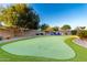 Large backyard features an artificial putting green at 21084 E Cherrywood Dr, Queen Creek, AZ 85142