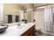 Well-lit bathroom features a shower-tub combo and modern vanity at 21084 E Cherrywood Dr, Queen Creek, AZ 85142
