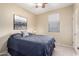 A bedroom with a large bed, neutral walls, and nice natural lighting at 21084 E Cherrywood Dr, Queen Creek, AZ 85142