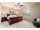 Spacious bedroom with a ceiling fan, a window with natural light, and neutral colored walls at 21084 E Cherrywood Dr, Queen Creek, AZ 85142