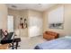 Bedroom with a window, closet, keyboard, and storage bench at 21084 E Cherrywood Dr, Queen Creek, AZ 85142