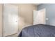 Cozy bedroom with neutral walls and door leading to ensuite bathroom at 21084 E Cherrywood Dr, Queen Creek, AZ 85142
