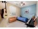 Cozy bedroom with musical instruments and a storage bench at 21084 E Cherrywood Dr, Queen Creek, AZ 85142