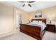 This bedroom showcases the furnishings, neutral colors, and view to the bathroom at 21084 E Cherrywood Dr, Queen Creek, AZ 85142