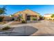 Charming single-story home with a well-maintained front yard and a two-car garage at 21084 E Cherrywood Dr, Queen Creek, AZ 85142
