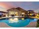 Inviting backyard pool featuring an outdoor dining area with grill perfect for entertaining and relaxing at 21084 E Cherrywood Dr, Queen Creek, AZ 85142