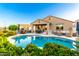Sparkling pool and backyard area for relaxing and entertaining at 21084 E Cherrywood Dr, Queen Creek, AZ 85142