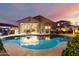 Inviting backyard pool featuring an outdoor dining area with grill perfect for entertaining and relaxing at 21084 E Cherrywood Dr, Queen Creek, AZ 85142