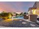 Gorgeous backyard pool featuring a lush desert landscaped backyard for relaxing outdoor living at 21084 E Cherrywood Dr, Queen Creek, AZ 85142