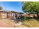 Scenic backyard showcasing lattice and room for gardening and outdoor activities at 2114 N 69Th Pl, Scottsdale, AZ 85257