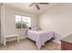 Bedroom with a bed, window, rug, and small table at 2114 N 69Th Pl, Scottsdale, AZ 85257