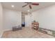 Spacious bedroom with large tile flooring, a window, and ceiling fan at 2114 N 69Th Pl, Scottsdale, AZ 85257