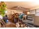 Cluttered garage with storage items and equipment at 2114 N 69Th Pl, Scottsdale, AZ 85257