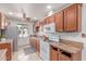 Bright kitchen with tiled floors, abundant cabinet space, and essential appliances at 2114 N 69Th Pl, Scottsdale, AZ 85257