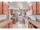 Functional kitchen with tiled floors, plenty of counter space, and modern appliances at 2114 N 69Th Pl, Scottsdale, AZ 85257