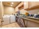 Laundry room with a utility sink and washer and dryer at 2114 N 69Th Pl, Scottsdale, AZ 85257