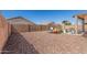 Backyard featuring gravel and a playground at 2152 W Sunshine Butte Dr, San Tan Valley, AZ 85144