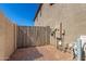 Utility panel and access gate in a gravel backyard at 2152 W Sunshine Butte Dr, San Tan Valley, AZ 85144