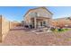 Backyard featuring a patio, gravel, and playground at 2152 W Sunshine Butte Dr, San Tan Valley, AZ 85144