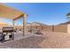 Backyard featuring a covered patio, gravel, and playground at 2152 W Sunshine Butte Dr, San Tan Valley, AZ 85144