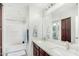 Bathroom featuring double sinks, a soaking tub, and modern fixtures at 2152 W Sunshine Butte Dr, San Tan Valley, AZ 85144