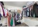 Walk-in closet with custom shelving and storage for organization at 2152 W Sunshine Butte Dr, San Tan Valley, AZ 85144