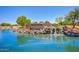 Scenic view of the San Tan Heights entrance showcasing a waterfall and serene pond at 2152 W Sunshine Butte Dr, San Tan Valley, AZ 85144