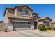 Charming two-story home with shutters and attached garage at 2152 W Sunshine Butte Dr, San Tan Valley, AZ 85144