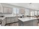 Kitchen features stainless steel appliances, granite countertops, and subway tile backsplash at 2152 W Sunshine Butte Dr, San Tan Valley, AZ 85144
