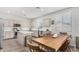 Eat-in kitchen features stainless steel appliances, granite countertops, and custom cabinets at 2152 W Sunshine Butte Dr, San Tan Valley, AZ 85144