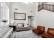 Bright living room features vaulted ceiling, hardwood floors, and modern furniture at 2152 W Sunshine Butte Dr, San Tan Valley, AZ 85144