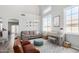 Bright living room features vaulted ceiling, hardwood floors, and modern furniture at 2152 W Sunshine Butte Dr, San Tan Valley, AZ 85144