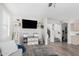 Bright living room featuring wood floors, recessed lights, and open floor plan at 2152 W Sunshine Butte Dr, San Tan Valley, AZ 85144