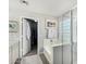 Bright main bathroom features dual sinks, custom cabinets, and glass enclosed shower at 2152 W Sunshine Butte Dr, San Tan Valley, AZ 85144