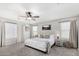 Bright main bedroom features a ceiling fan and an abundance of natural light at 2152 W Sunshine Butte Dr, San Tan Valley, AZ 85144
