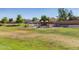 Neighborhood park with lush green grass, walking paths, and playground offer a relaxing outdoor space at 2152 W Sunshine Butte Dr, San Tan Valley, AZ 85144