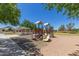 Well-maintained community playground with play structures and shaded seating, perfect for children and families at 2152 W Sunshine Butte Dr, San Tan Valley, AZ 85144