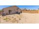 Expansive backyard featuring low-maintenance gravel landscaping, block wall fencing, and a covered patio at 22534 W Pima St, Buckeye, AZ 85326