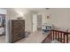Bedroom including a crib, changing table, dresser, and an open doorway at 22534 W Pima St, Buckeye, AZ 85326