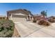 Beautiful single-story home with two car garage, low maintenance landscaping, and concrete driveway at 22534 W Pima St, Buckeye, AZ 85326