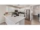 Bright kitchen featuring a stainless steel fridge, granite counters, new faucet, and ample cabinet space at 22534 W Pima St, Buckeye, AZ 85326