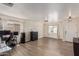 Spacious living room featuring wood-look floors, neutral walls, and bright natural light at 22534 W Pima St, Buckeye, AZ 85326