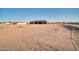 Expansive backyard view with a clear blue sky at 22548 W Huntington Dr, Buckeye, AZ 85326