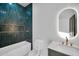 Stylish bathroom featuring a modern vanity, toilet, and tiled shower/tub combo at 22548 W Huntington Dr, Buckeye, AZ 85326