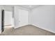 Cozy carpeted bedroom featuring a closet with white sliding doors at 22548 W Huntington Dr, Buckeye, AZ 85326