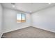 Bright, empty bedroom with neutral carpet, a window, and recessed lighting at 22548 W Huntington Dr, Buckeye, AZ 85326