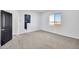 Neutral bedroom with carpet, white walls, and a bright window, offering a cozy and inviting atmosphere at 22548 W Huntington Dr, Buckeye, AZ 85326