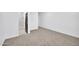 Comfortable bedroom with neutral carpet and hall entrance to bathroom at 22548 W Huntington Dr, Buckeye, AZ 85326