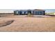Inviting single-story home with a well-manicured front yard and modern architectural details at 22548 W Huntington Dr, Buckeye, AZ 85326