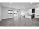 Open-concept kitchen and living room featuring recessed lighting and sliding door to backyard at 22548 W Huntington Dr, Buckeye, AZ 85326